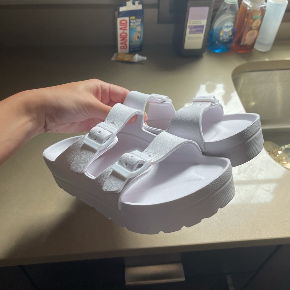 White buckled sandals
